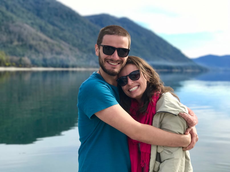 Hugging Couple Near the Body of Water